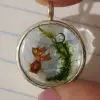 Charm With Orange Goldfish In Clear Water