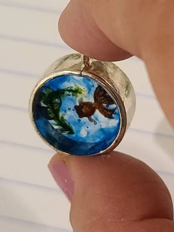 Unique Charm With Orange Goldfish In Blue Water