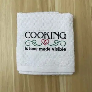 Cooking is love made visible embroidered kitchen towel