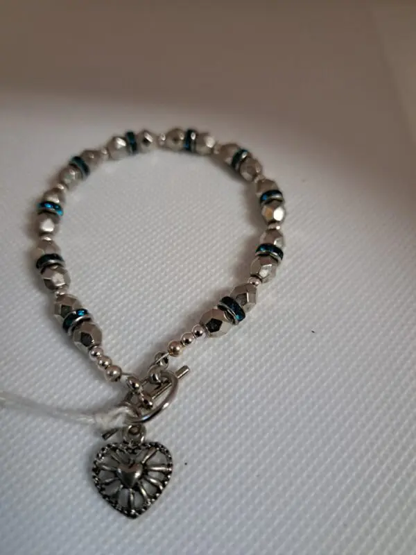 Luxurious Faceted Silver Bead Bracelet Interspersed With Blue Crystals