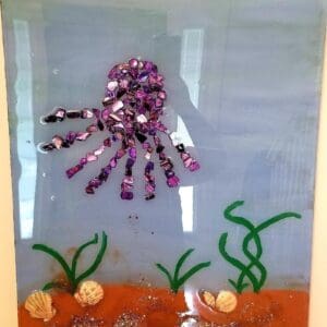 Glass Mosaic Purple Octopus Swimming Above the Ocean Floor