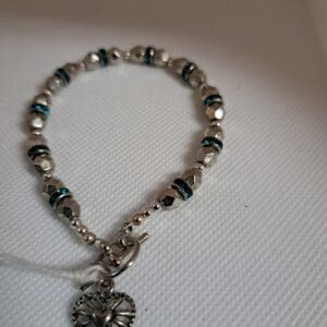 Luxurious Faceted Silver Bead Bracelet Interspersed with Blue Crystals